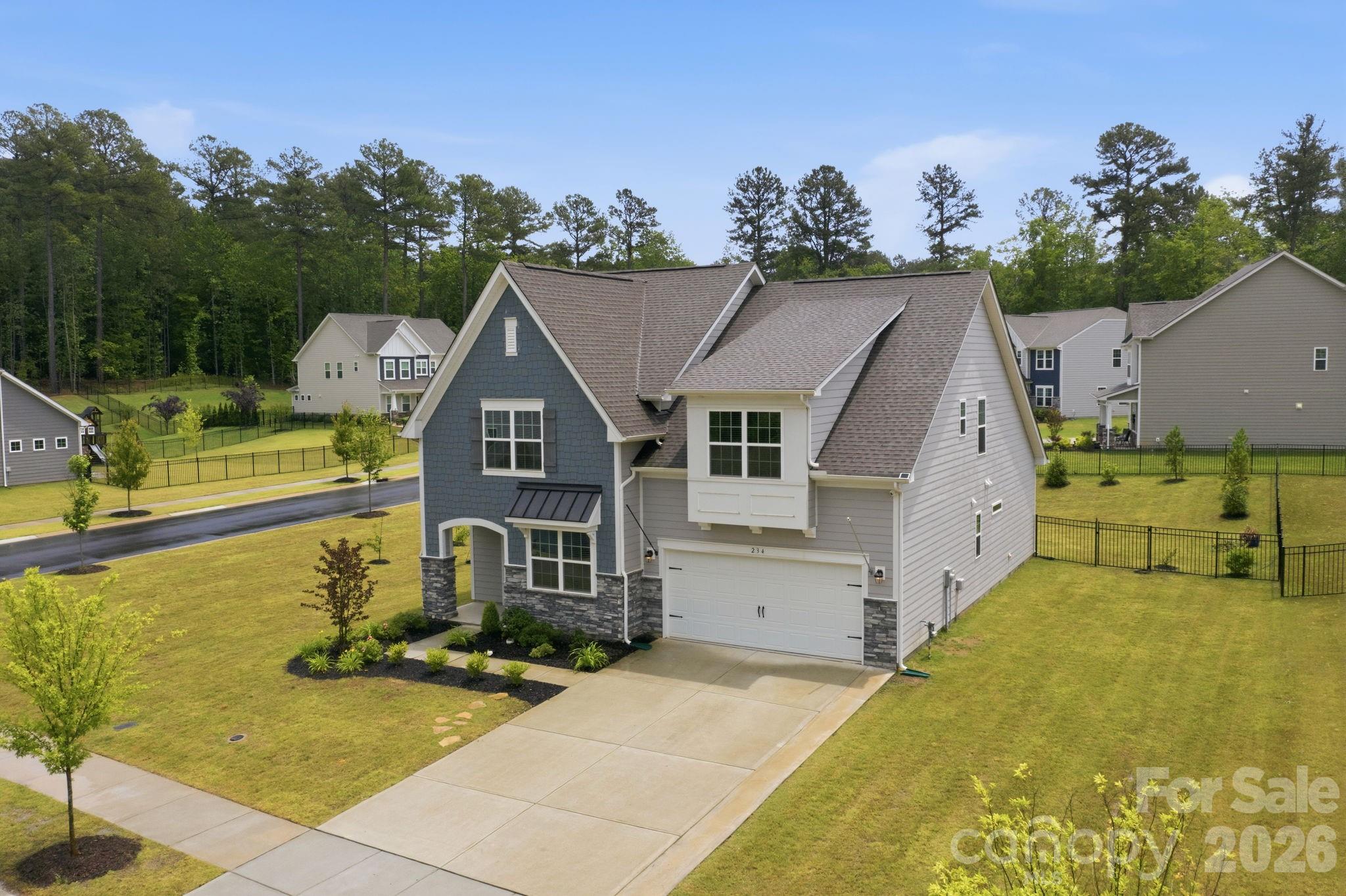 234 Hamptons Cove Road Troutman, NC 28166 - Photo 2 of 32 a view of a house with pool