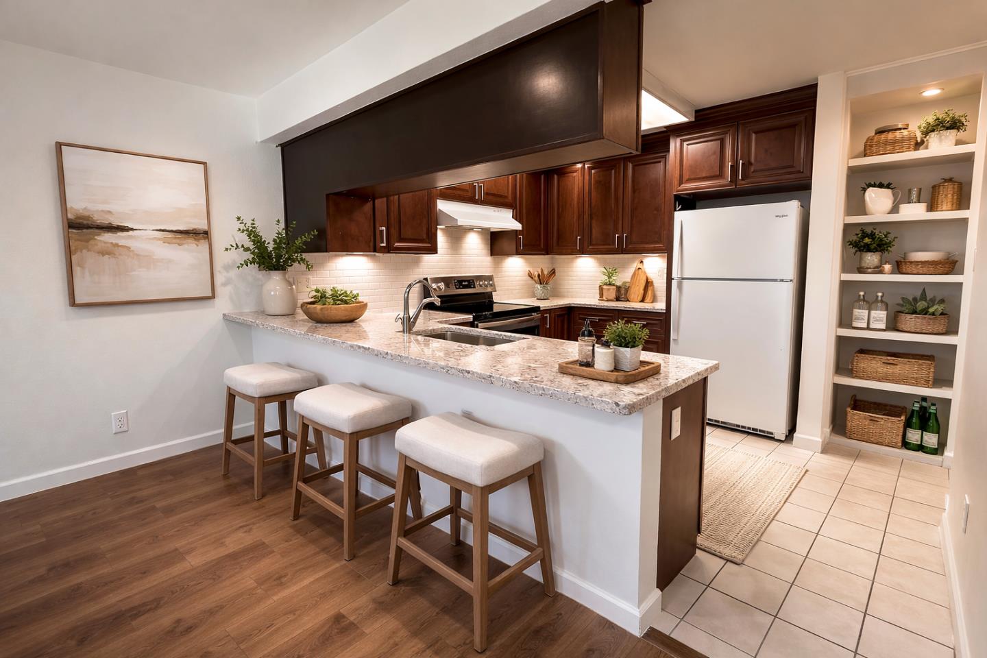 2212 Almaden Road, Unit A San Jose, CA 95125 - Photo 4 of 15 a kitchen with stainless steel appliances a stove a refrigerator a sink and a dining table with wooden floor