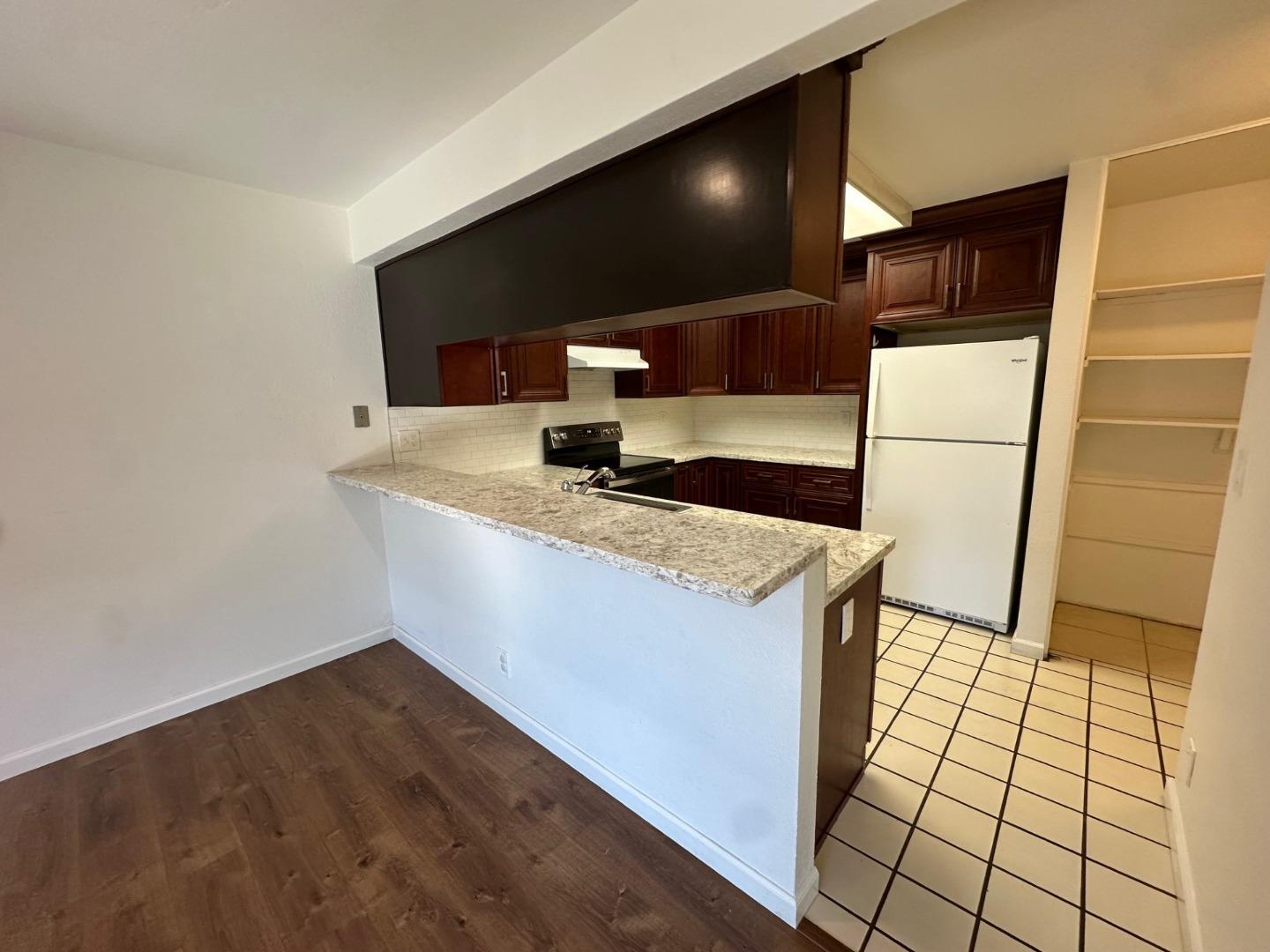 2212 Almaden Road, Unit A San Jose, CA 95125 - Photo 7 of 15 a kitchen with a sink and a refrigerator