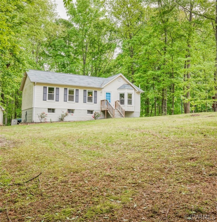 240 Cedar Ridge Drive Ruther Glen, VA 22546 - Photo 3 of 34 a view of a house with a yard