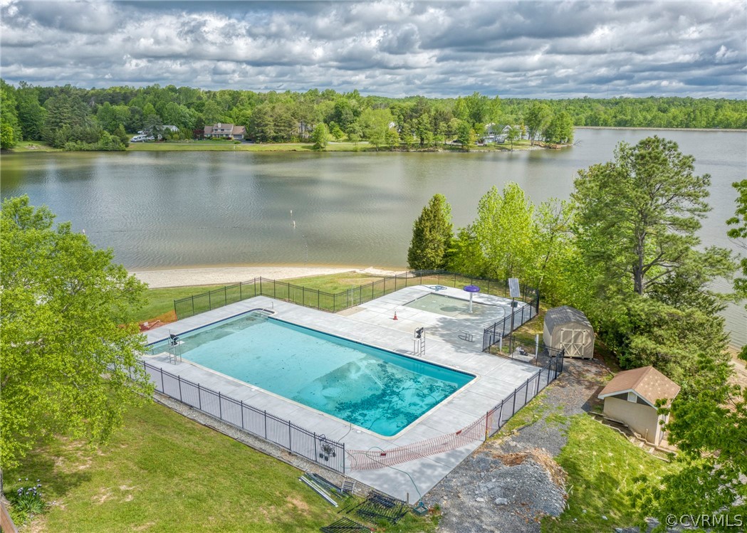 240 Cedar Ridge Drive Ruther Glen, VA 22546 - Photo 31 of 34 a view of a swimming pool with a yard and plants
