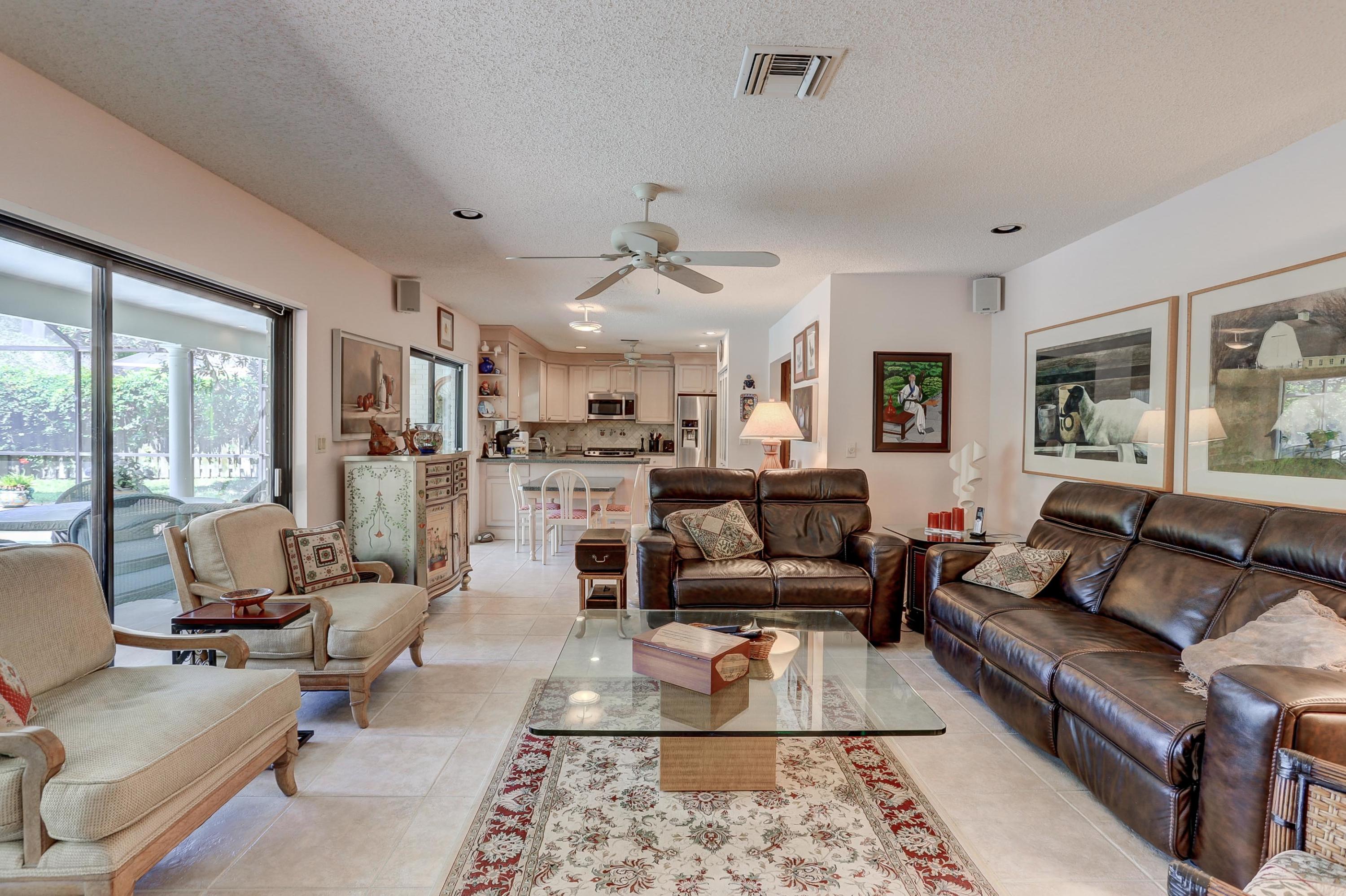 6835 Viento Way Boca Raton, FL 33433 - Photo 11 of 43 a living room with furniture and a rug