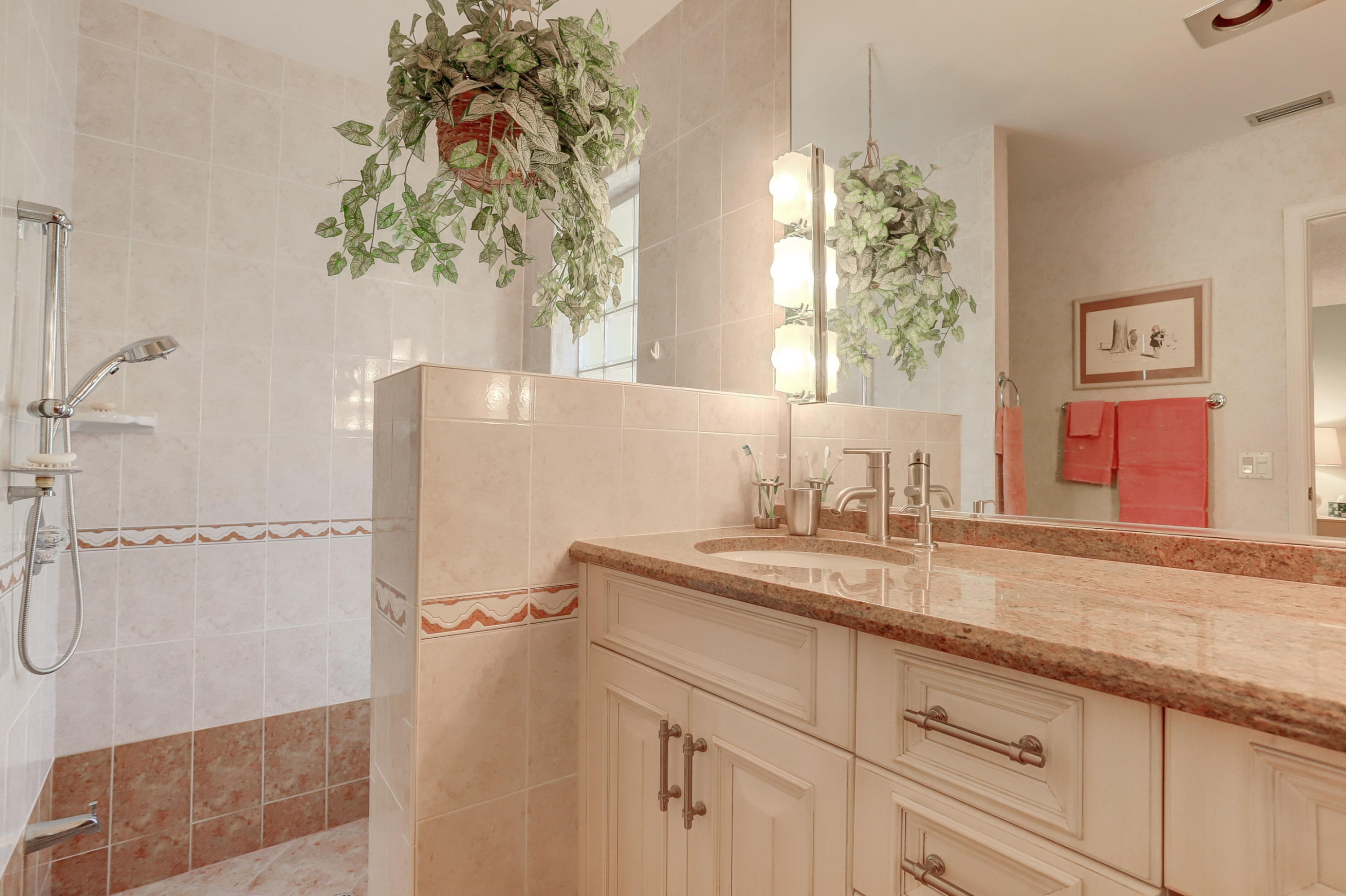 6835 Viento Way Boca Raton, FL 33433 - Photo 21 of 43 a bathroom with a granite countertop sink a mirror and shower