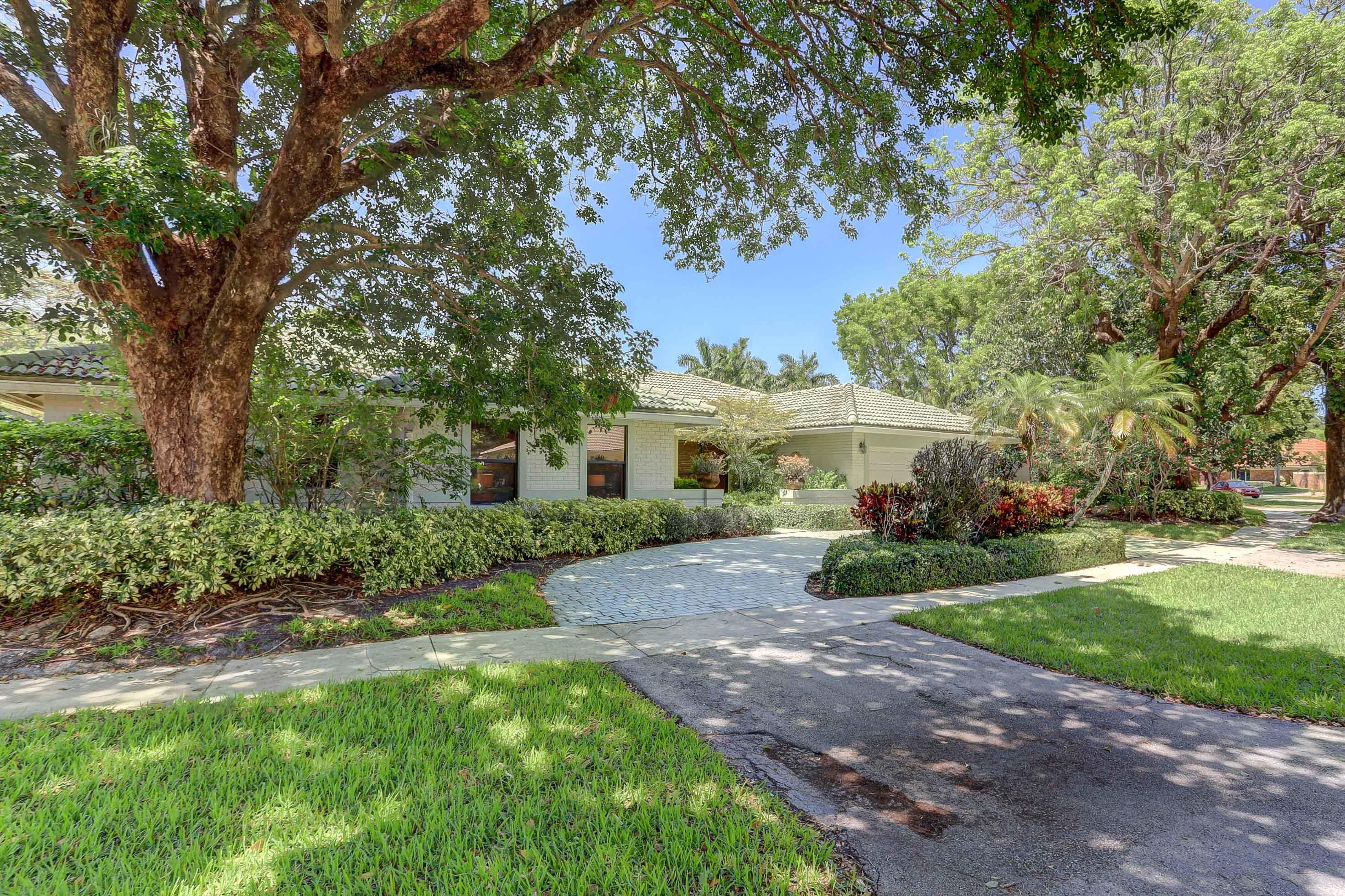 6835 Viento Way Boca Raton, FL 33433 - Photo 3 of 43 a view of a house with a yard