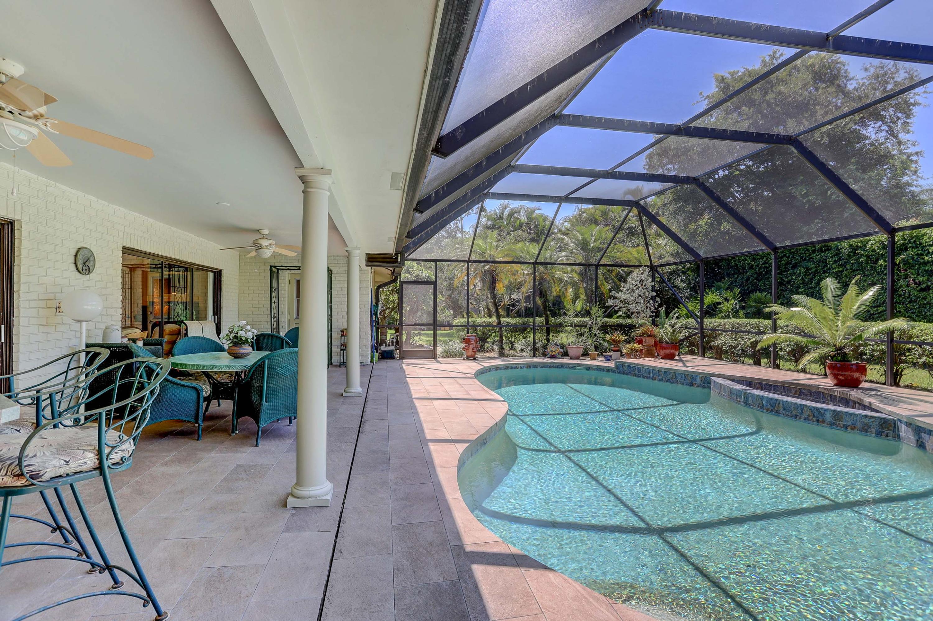 6835 Viento Way Boca Raton, FL 33433 - Photo 32 of 43 a view of a patio with dining table and chairs