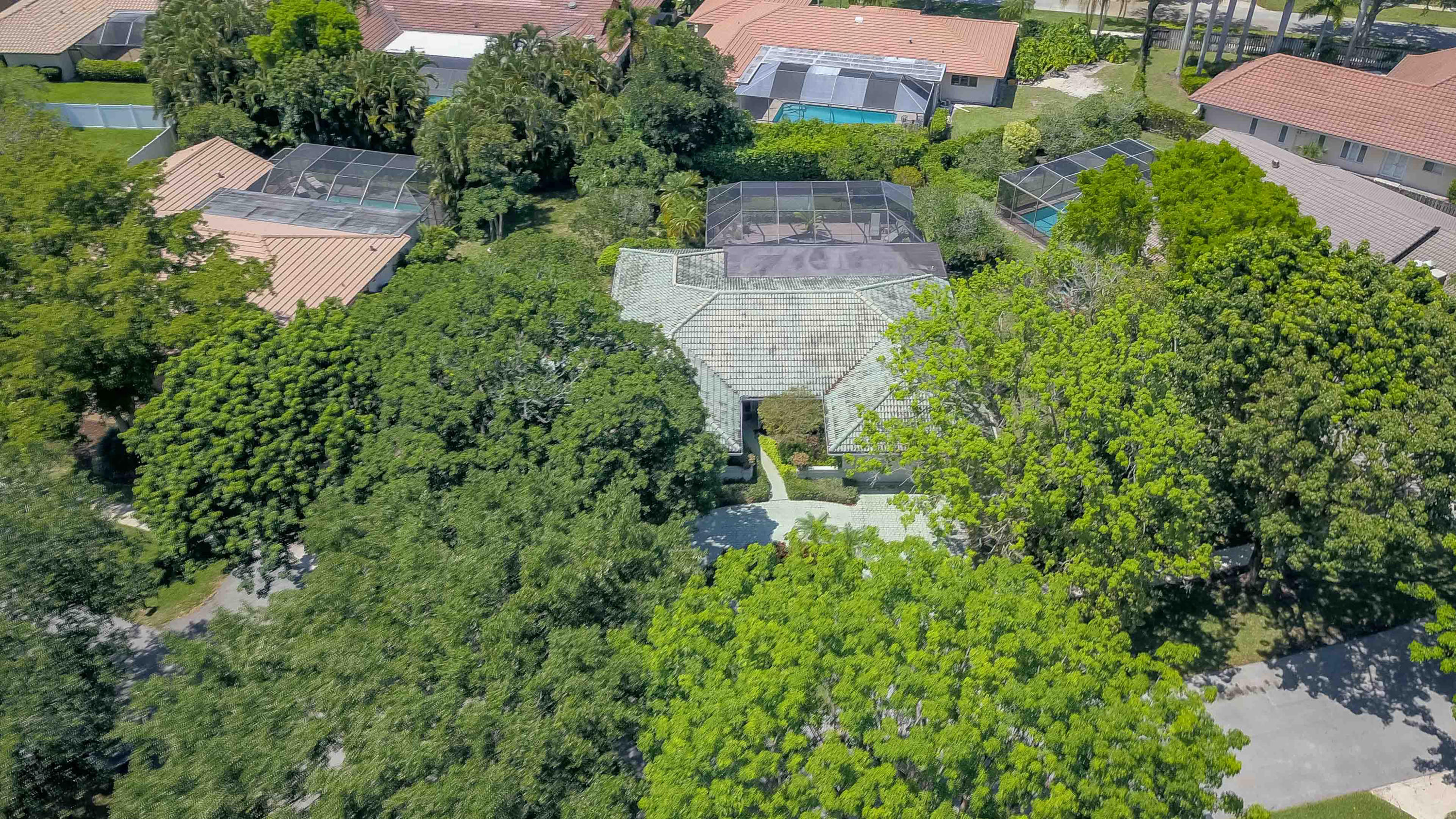 6835 Viento Way Boca Raton, FL 33433 - Photo 38 of 43 an aerial view of residential house with outdoor space and trees all around