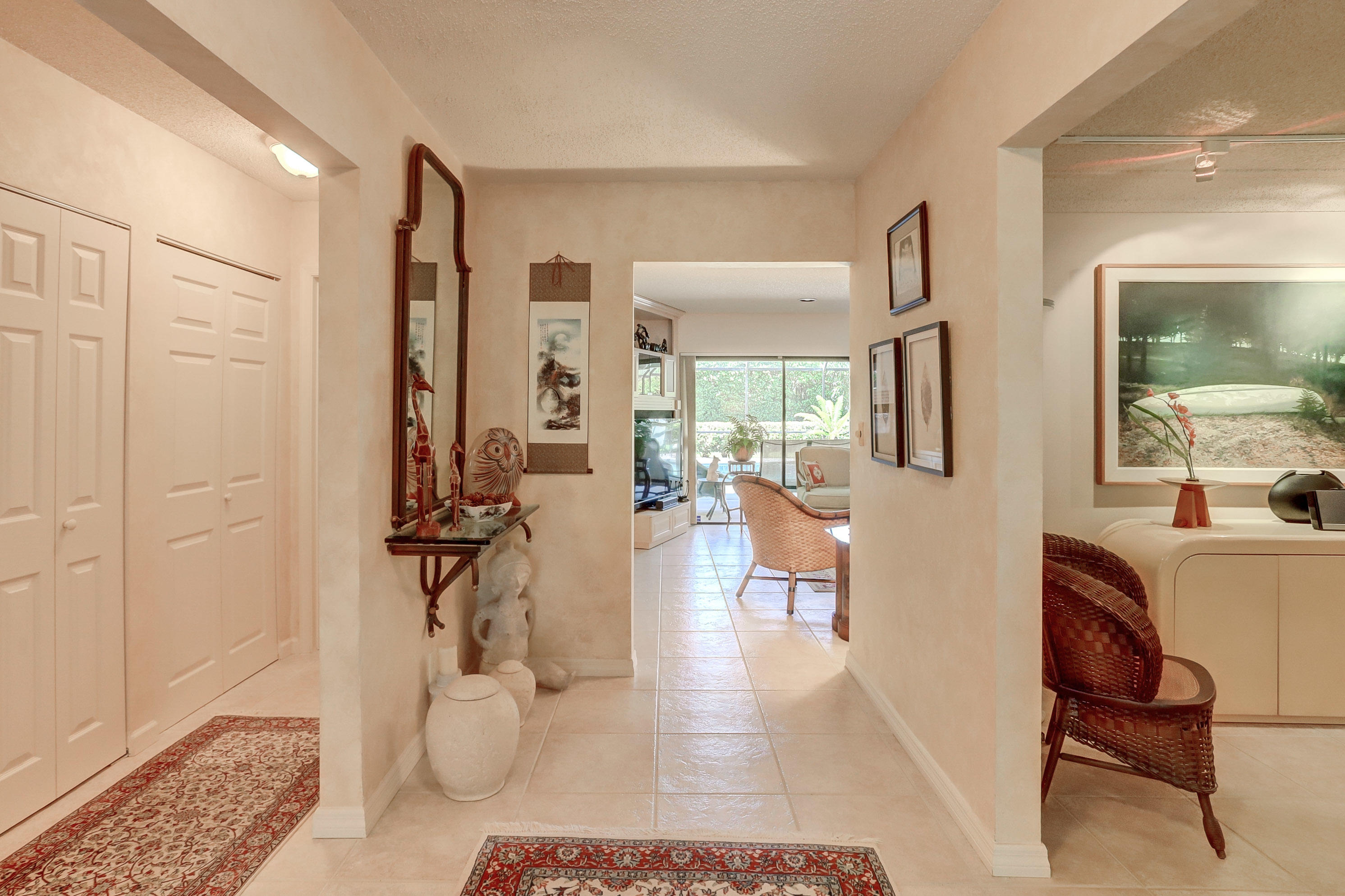 6835 Viento Way Boca Raton, FL 33433 - Photo 6 of 43 a living room with furniture a rug and white walls