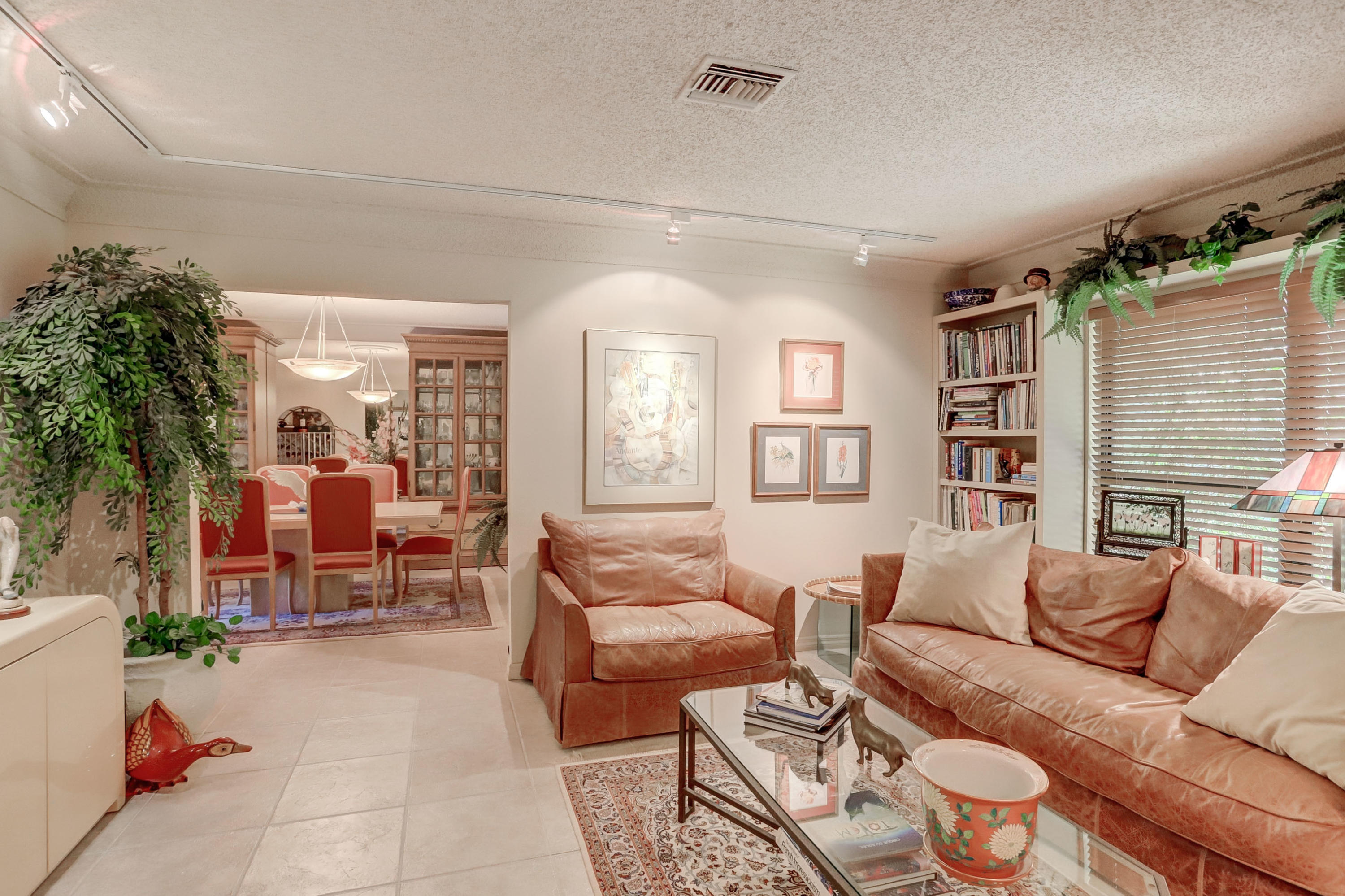 6835 Viento Way Boca Raton, FL 33433 - Photo 7 of 43 a living room with furniture and a large window