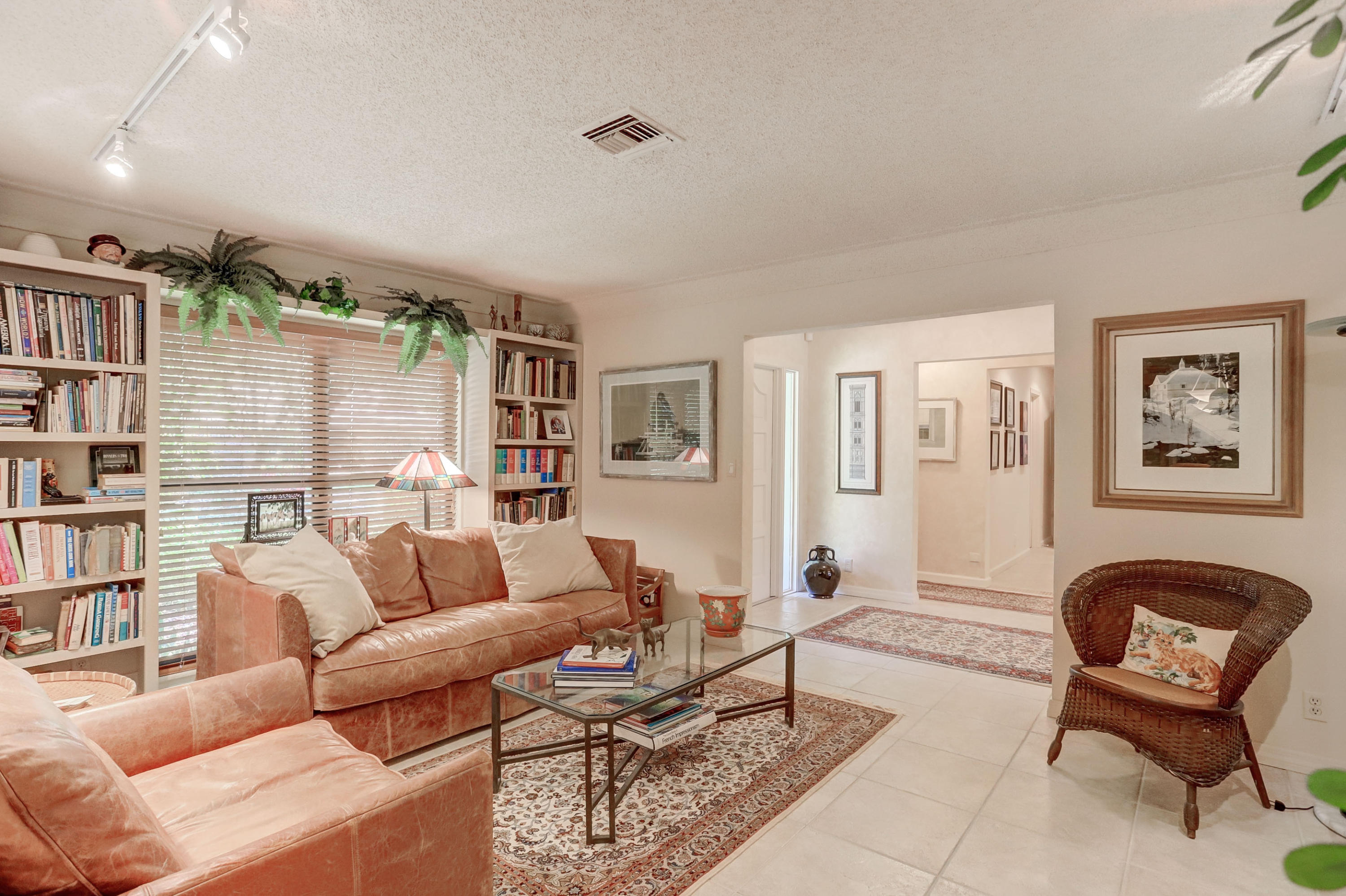 6835 Viento Way Boca Raton, FL 33433 - Photo 9 of 43 a living room with furniture a rug and a couch