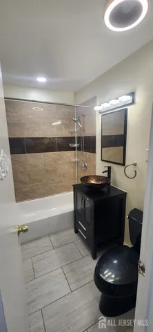 a room with a couch and a potted plant