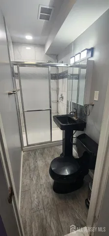 a water heater sitting in a bathroom