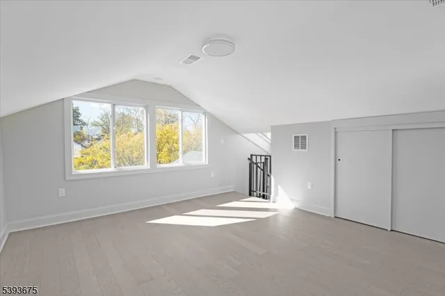 an empty room with windows and entrance