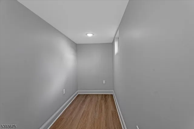 a view of room with wooden floor