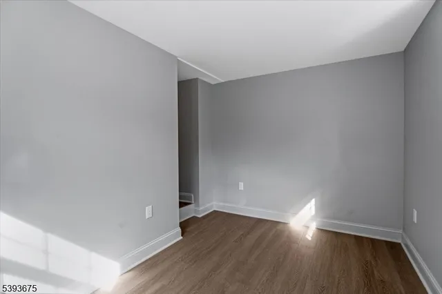 a view of room with wooden floor