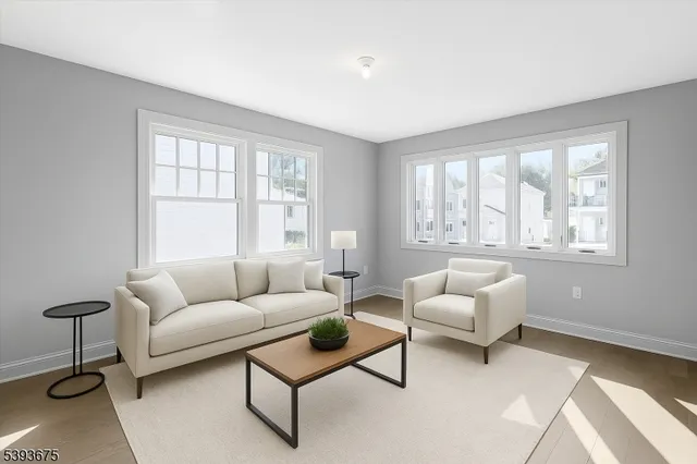 a living room with furniture and windows