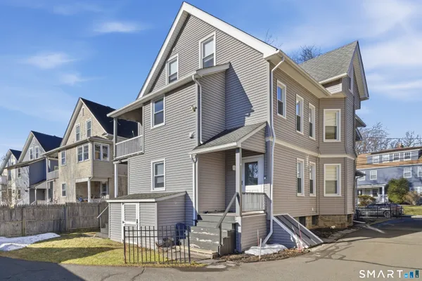 a view of a house with tub and chairs