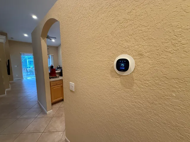 a view of a chairs and table in the balcony