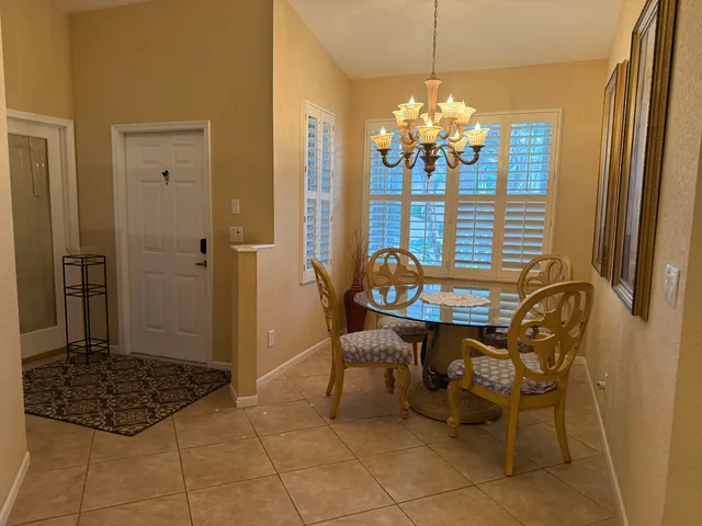 a bedroom with a bed dresser and a window