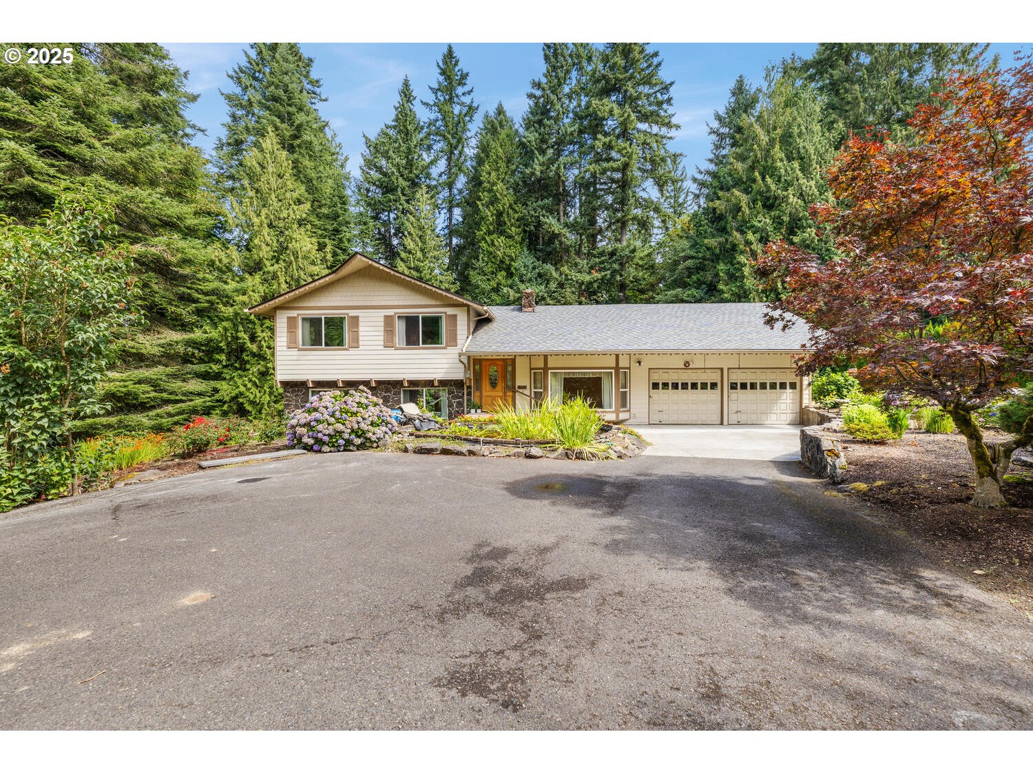 3208 Northwest 199th Street Ridgefield, WA 98642 - Photo 1 of 48 a front view of a house with a yard and garage