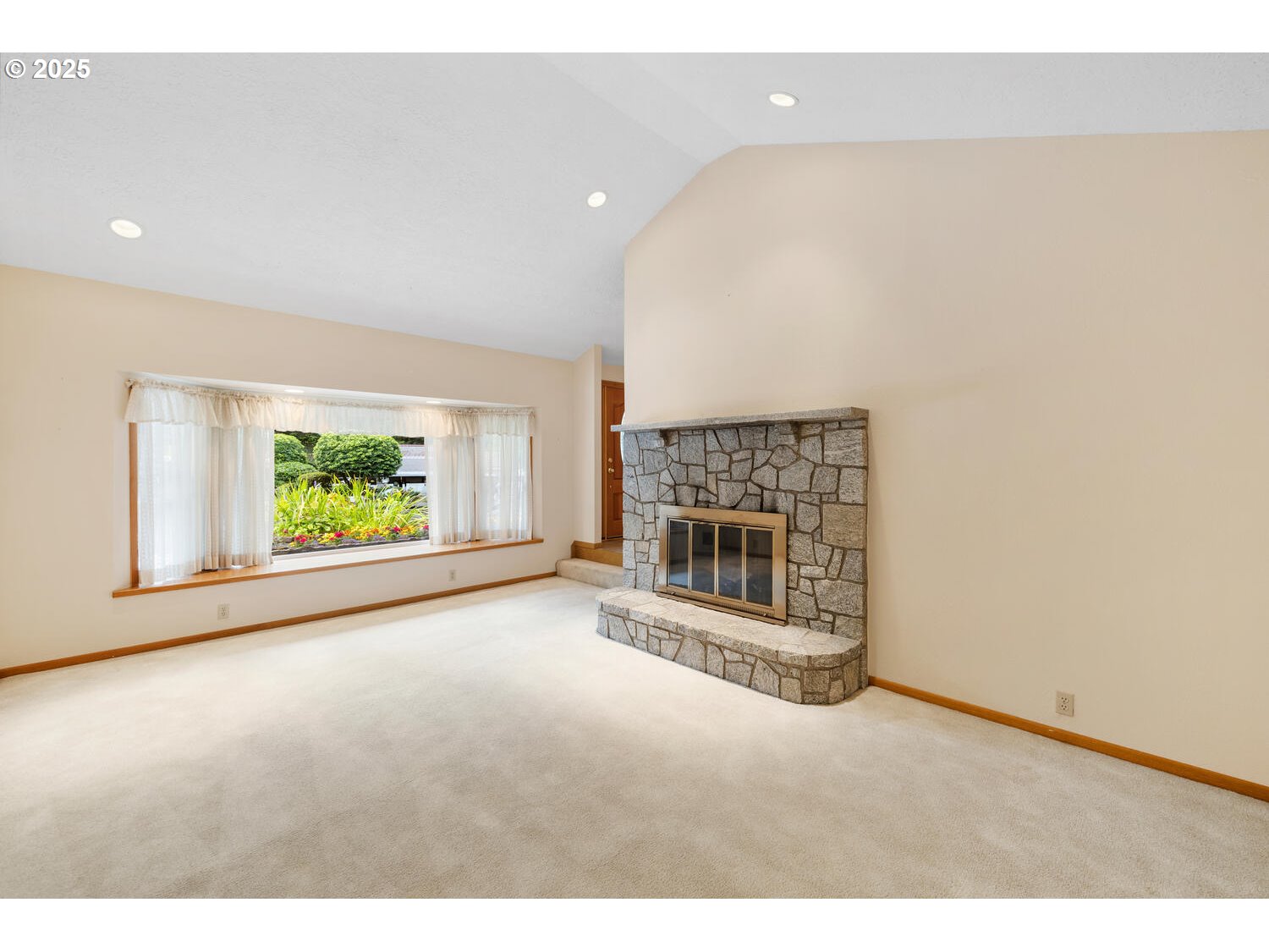 3208 Northwest 199th Street Ridgefield, WA 98642 - Photo 18 of 48 a view of an empty room with a fireplace and a window