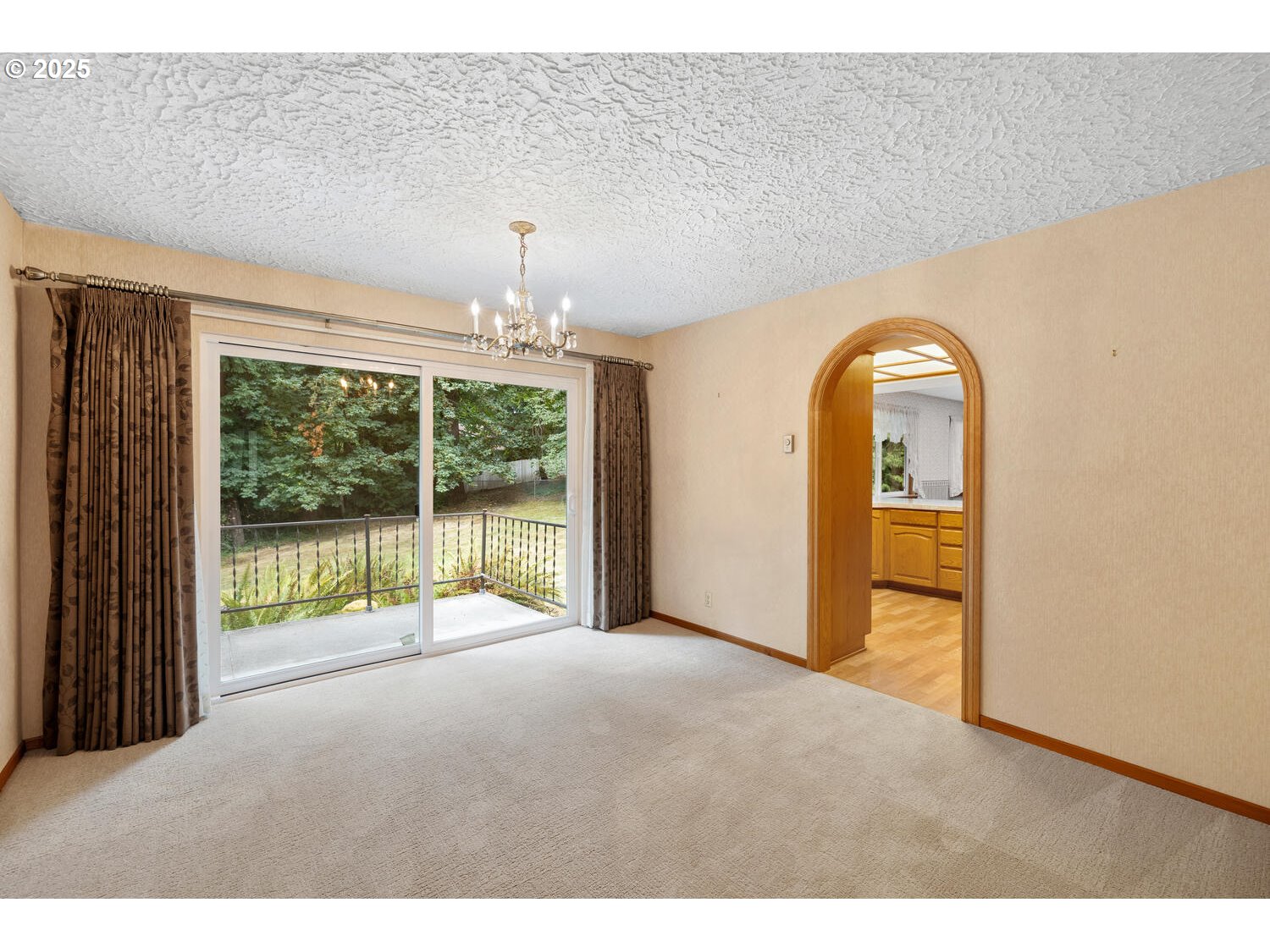 3208 Northwest 199th Street Ridgefield, WA 98642 - Photo 19 of 48 a view of an empty room with glass door and balcony