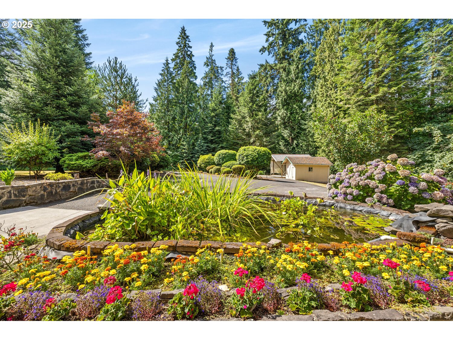 3208 Northwest 199th Street Ridgefield, WA 98642 - Photo 3 of 48 a view of a garden with flowers