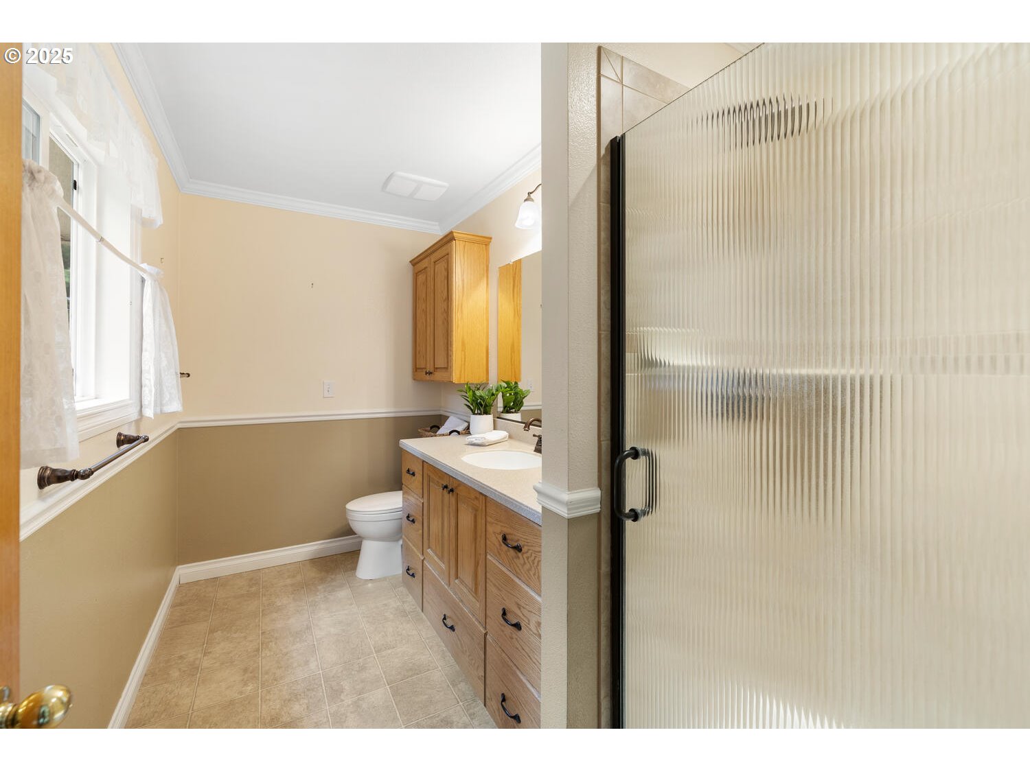 3208 Northwest 199th Street Ridgefield, WA 98642 - Photo 31 of 48 a bathroom with a sink a toilet and shower
