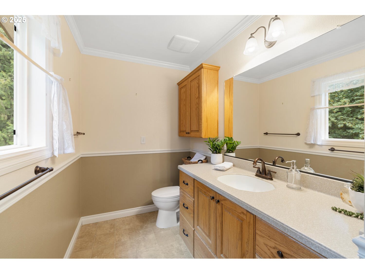 3208 Northwest 199th Street Ridgefield, WA 98642 - Photo 32 of 48 a bathroom with a sink a toilet a mirror and bathtub