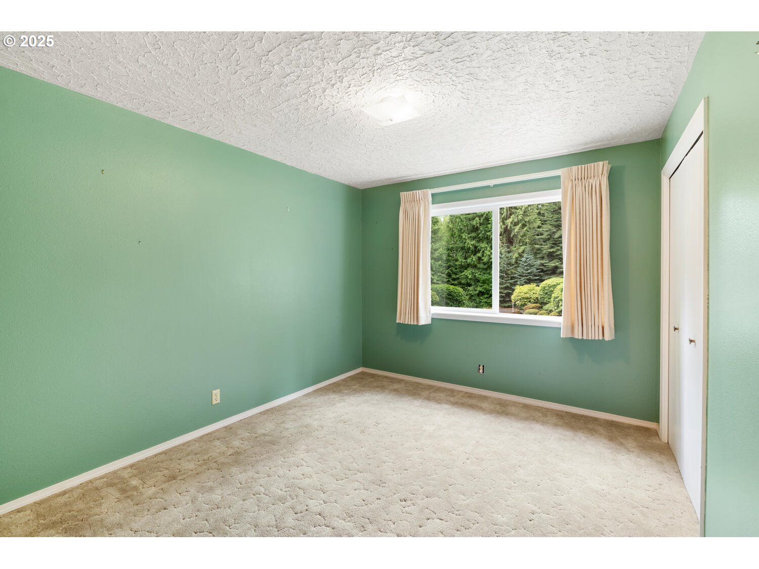 3208 Northwest 199th Street Ridgefield, WA 98642 - Photo 34 of 48 a view of an empty room with a window