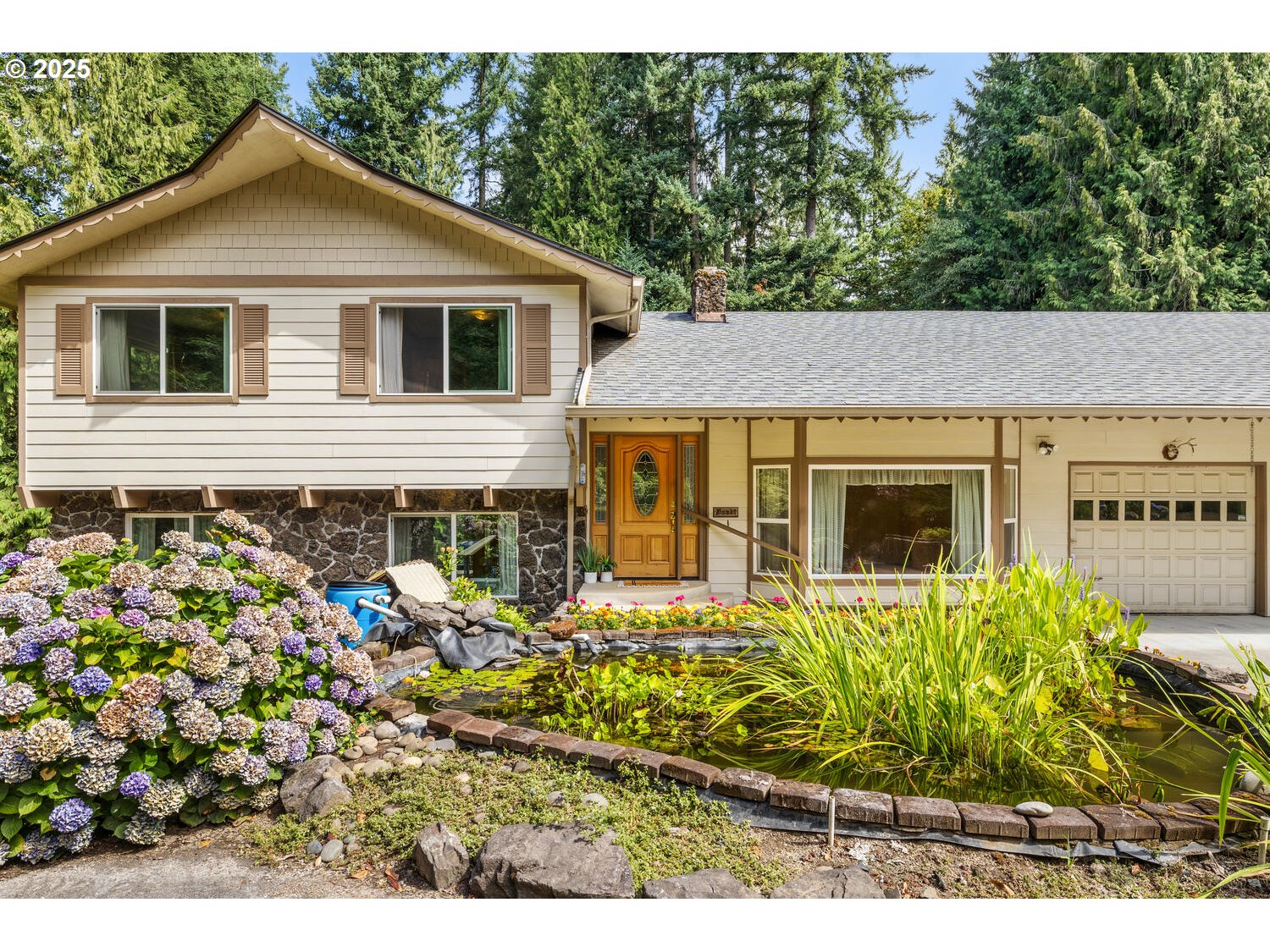 3208 Northwest 199th Street Ridgefield, WA 98642 - Photo 7 of 48 a view of a house with a small yard and potted plants