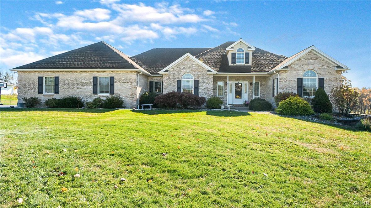 573 West Moorestown Road Nazareth, PA 18064 - Photo 1 of 46 a front view of a house with yard and green space