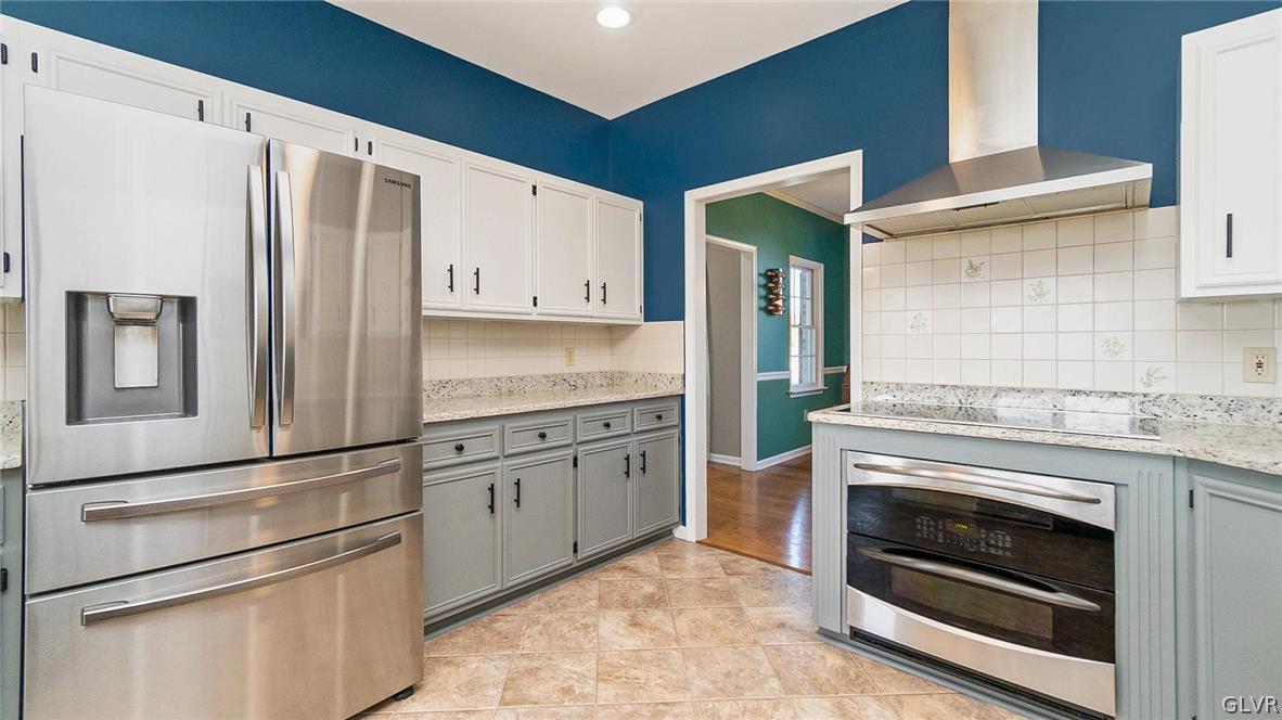 573 West Moorestown Road Nazareth, PA 18064 - Photo 13 of 46 a kitchen with stainless steel appliances granite countertop a refrigerator stove and sink