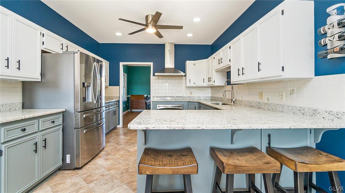 573 West Moorestown Road Nazareth, PA 18064 - Photo 15 of 46 a kitchen with stainless steel appliances granite countertop a sink a stove and a refrigerator