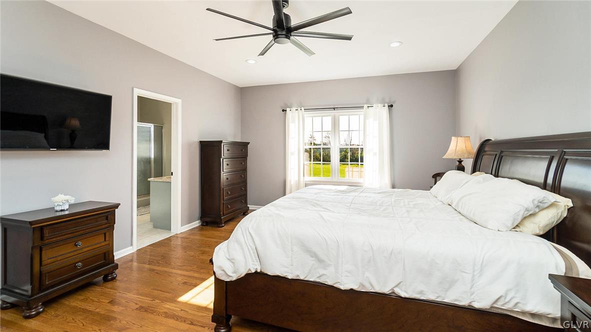 573 West Moorestown Road Nazareth, PA 18064 - Photo 19 of 46 a bedroom with a bed and a flat screen tv