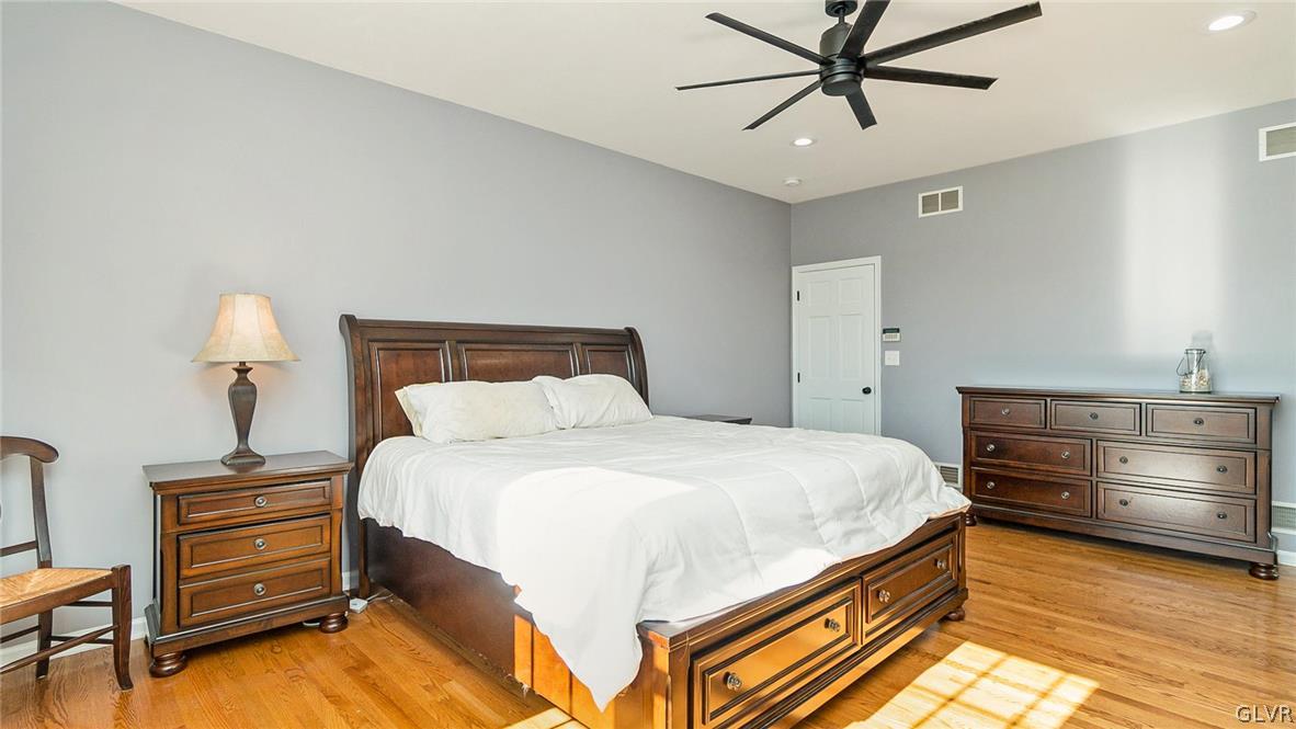 573 West Moorestown Road Nazareth, PA 18064 - Photo 20 of 46 a bedroom with a bed and a chandelier