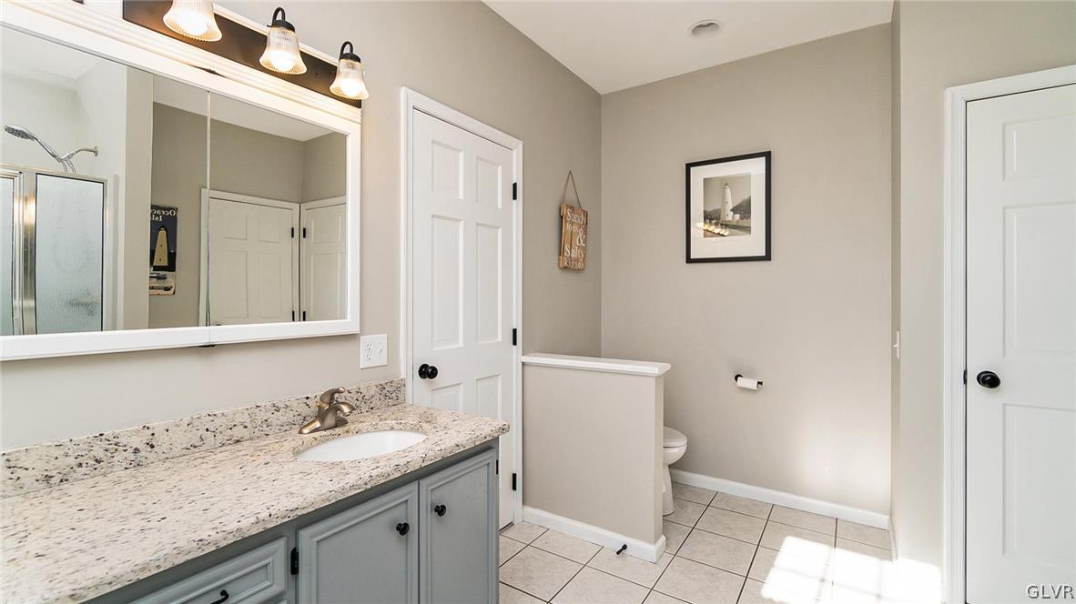 573 West Moorestown Road Nazareth, PA 18064 - Photo 23 of 46 a bathroom with a granite countertop sink toilet and mirror