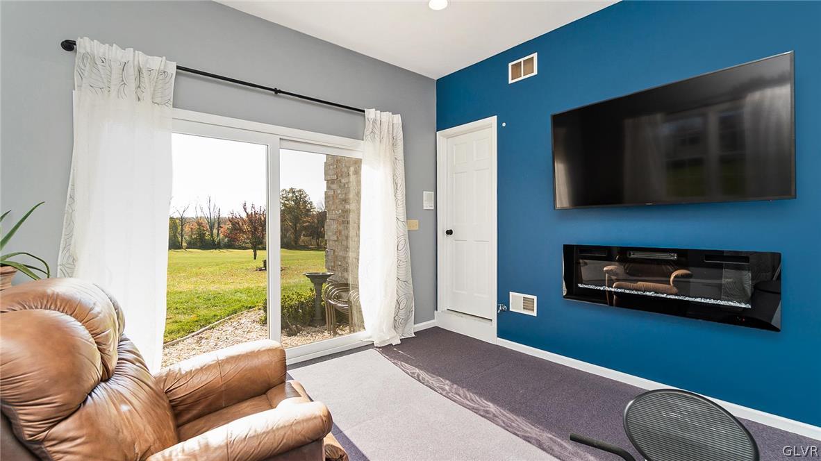 573 West Moorestown Road Nazareth, PA 18064 - Photo 25 of 46 a living room with furniture and a flat screen tv