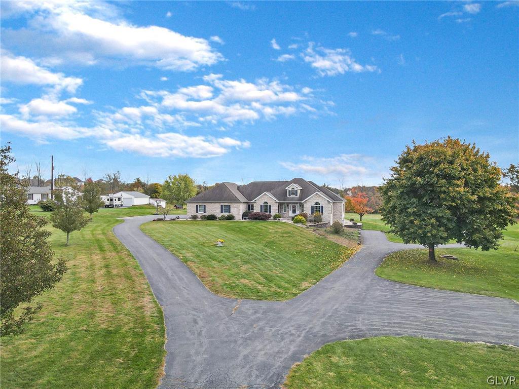 573 West Moorestown Road Nazareth, PA 18064 - Photo 3 of 46 a view of a garden with a building in the background