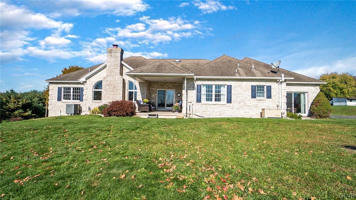 573 West Moorestown Road Nazareth, PA 18064 - Photo 36 of 46 a front view of a house with a garden