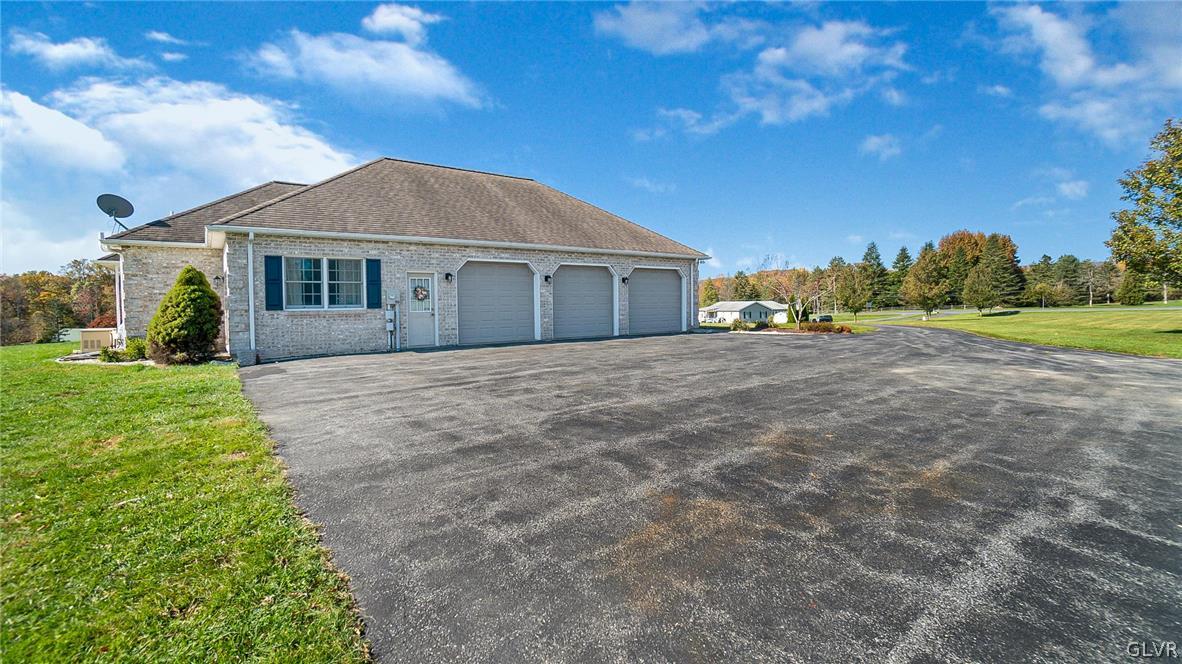 573 West Moorestown Road Nazareth, PA 18064 - Photo 39 of 46 a front view of a house with a yard and trees