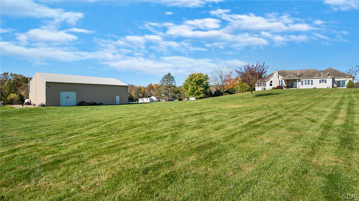573 West Moorestown Road Nazareth, PA 18064 - Photo 43 of 46 a view of a big house with a big yard and large trees