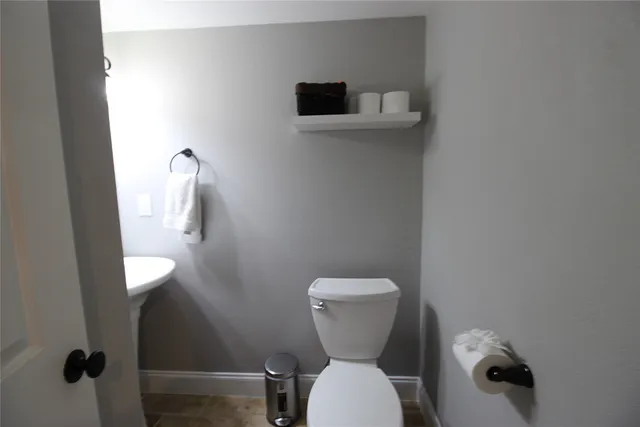 a bathroom with a toilet and a sink