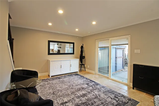 a living room with furniture and a rug