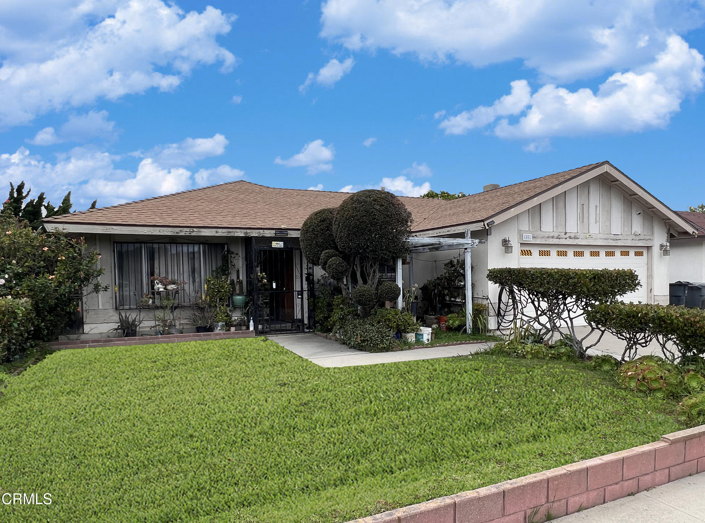 a view of a house with a yard porch and sitting area