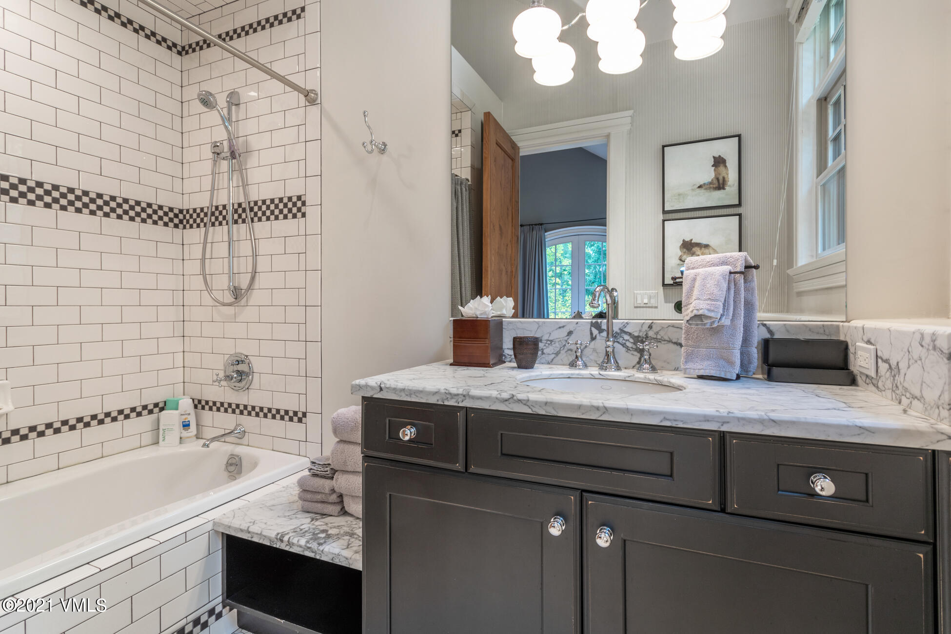 559 Eagle Drive Eagle-Vail, CO 81620 - Photo 32 of 50 a bathroom with a granite countertop sink a large mirror and shower