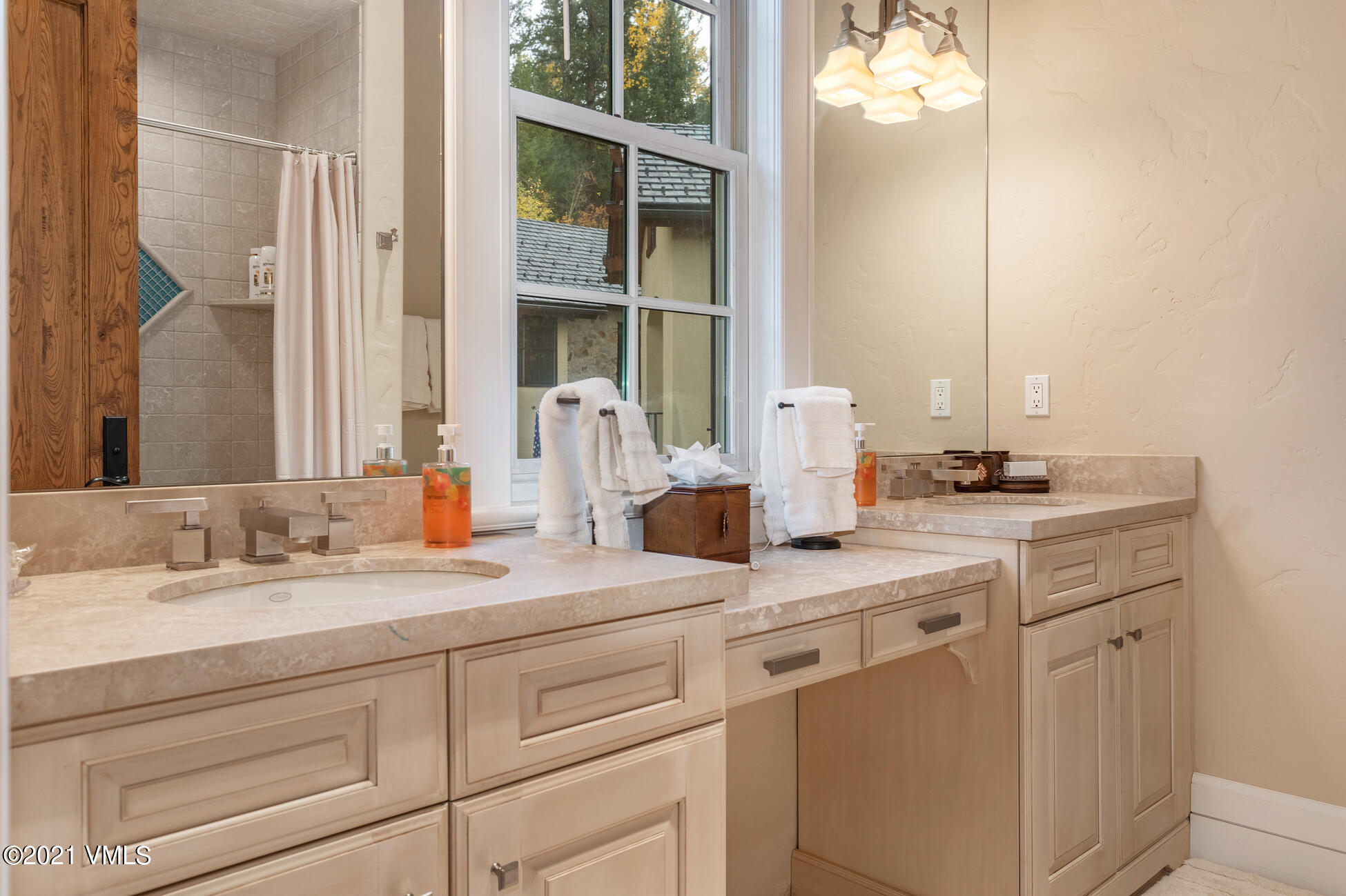 559 Eagle Drive Eagle-Vail, CO 81620 - Photo 36 of 50 a bathroom with a sink and a mirror