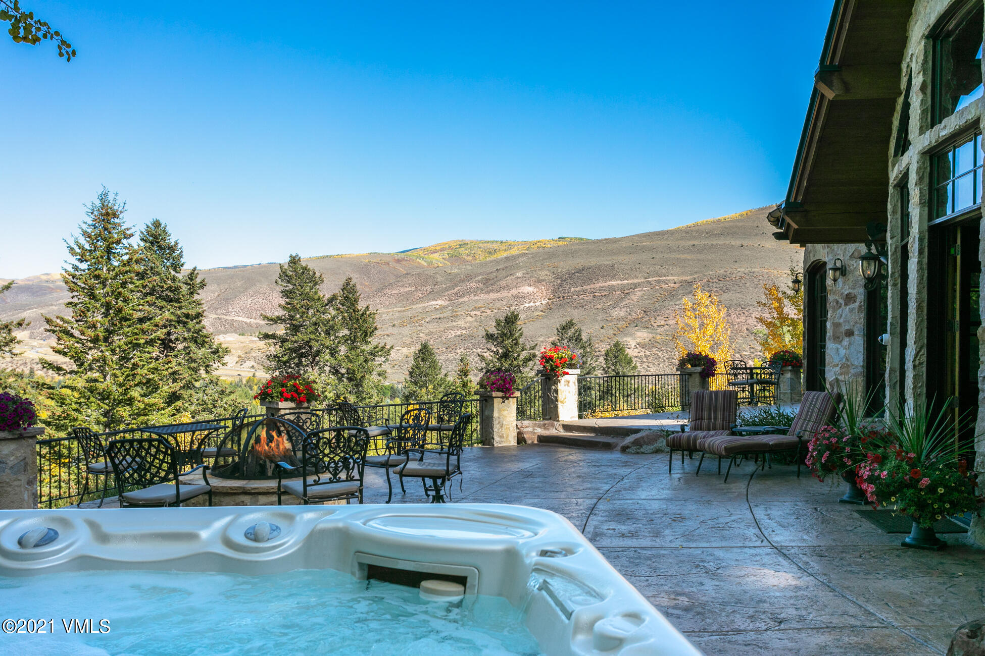 559 Eagle Drive Eagle-Vail, CO 81620 - Photo 8 of 50 a view of a patio with couches table and chairs and potted plants