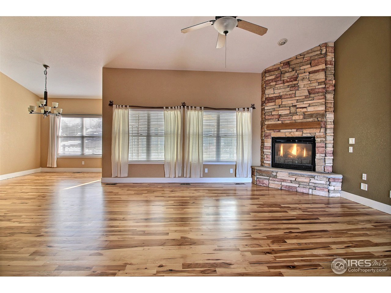 7700 Poudre River Road Greeley, CO 80634 - Photo 5 of 40 Cozy Gas Fireplace
