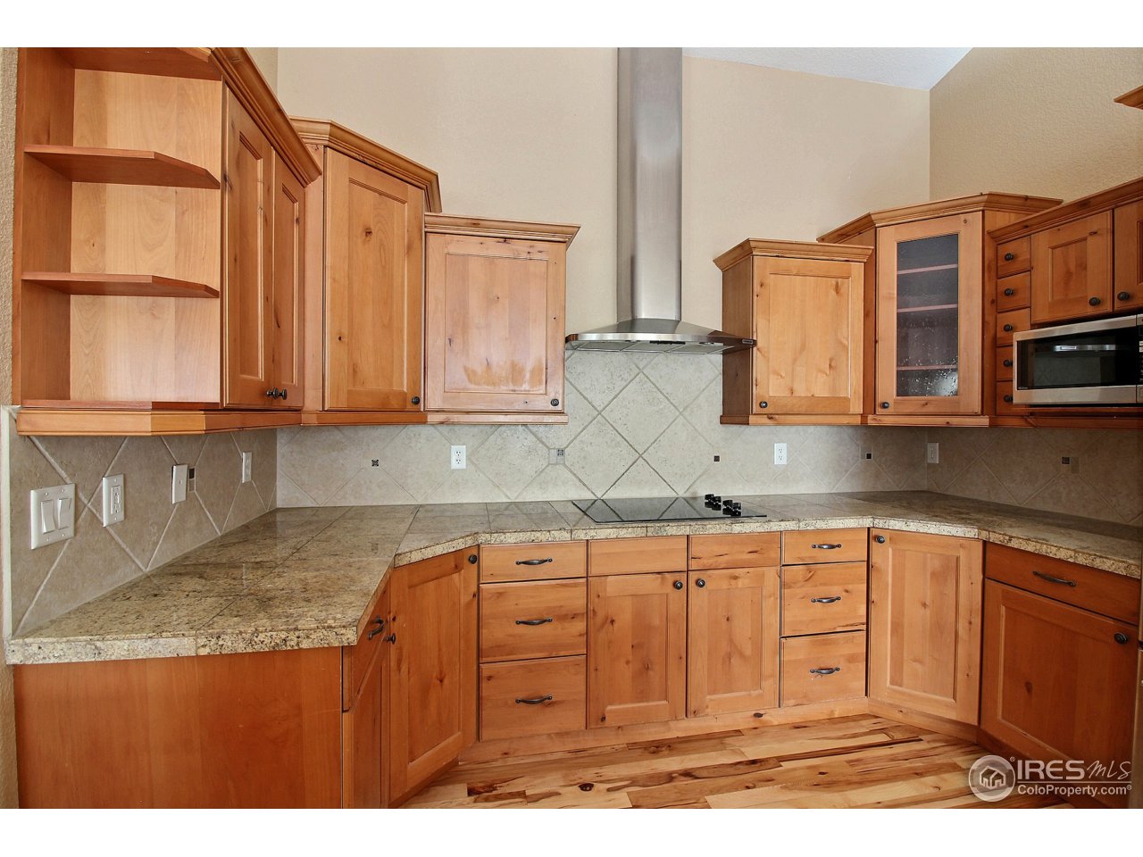 7700 Poudre River Road Greeley, CO 80634 - Photo 9 of 40 City Scaped Knotty Alder Cabinets