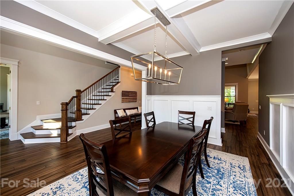 1286 Trinity Ridge Parkway Fort Mill, SC 29715 - Photo 12 of 48 a view of a dining room with furniture and wooden floor